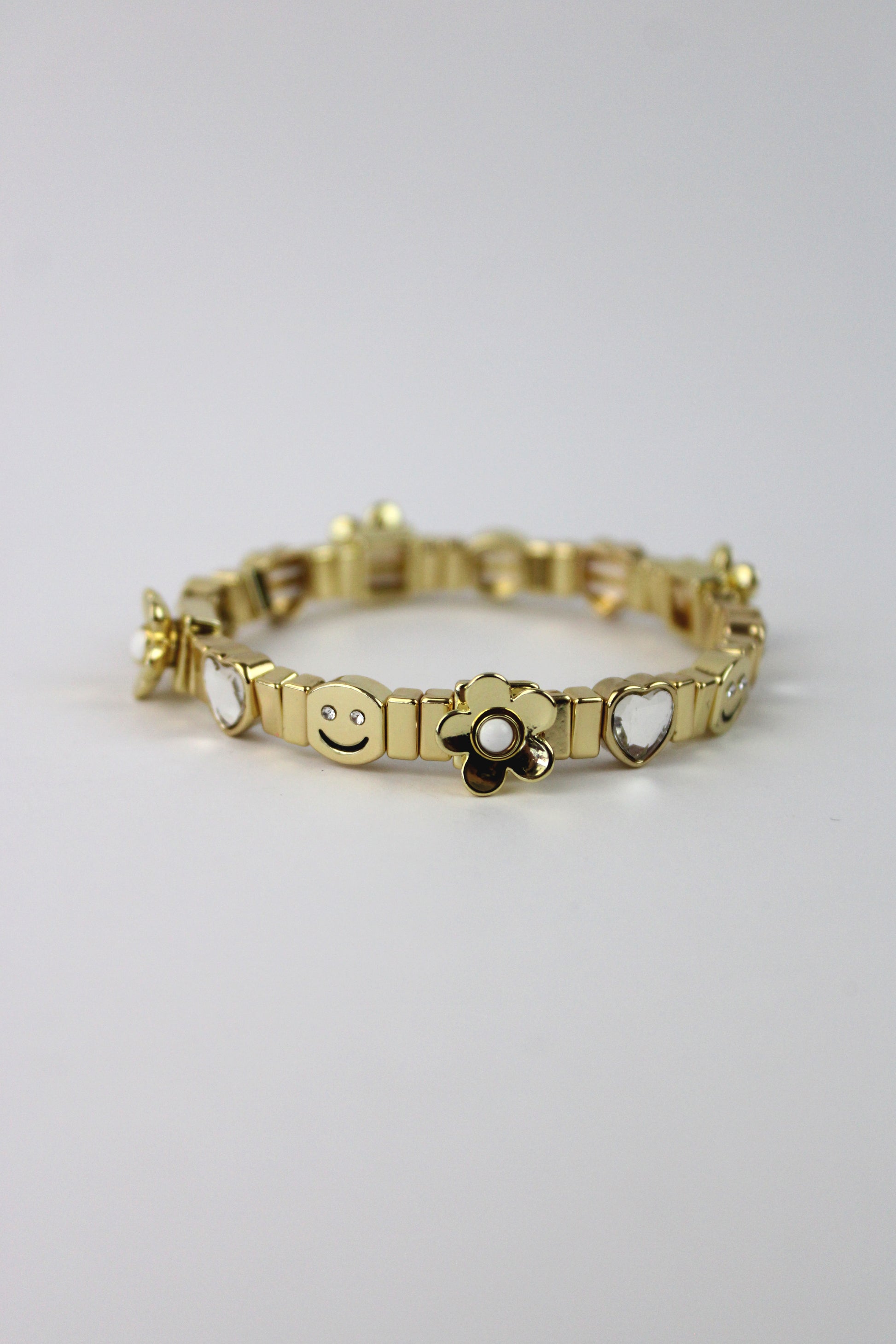 P275049 Pulsera Elastico Happy Face y Flores 3D