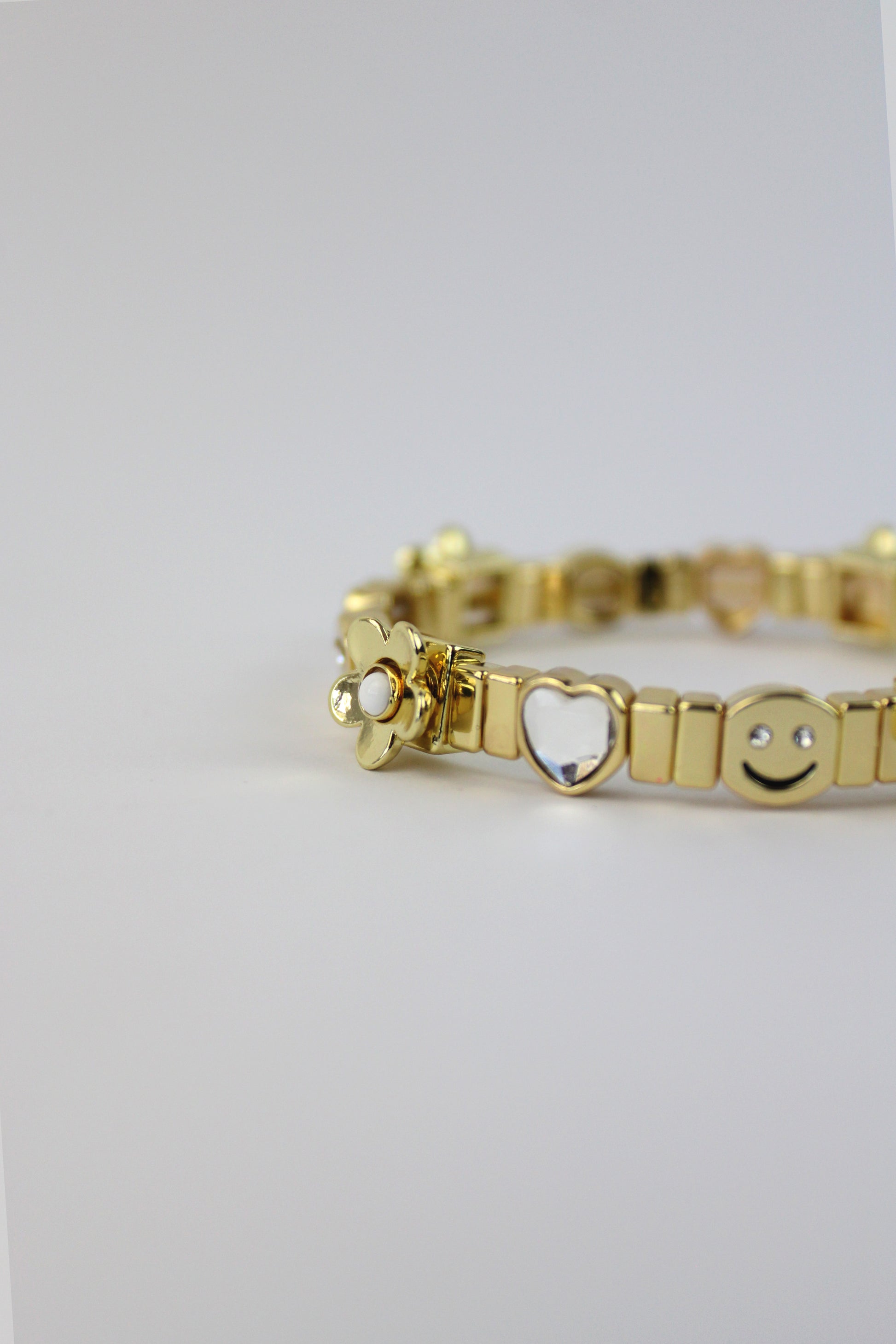P275049 Pulsera Elastico Happy Face y Flores 3D