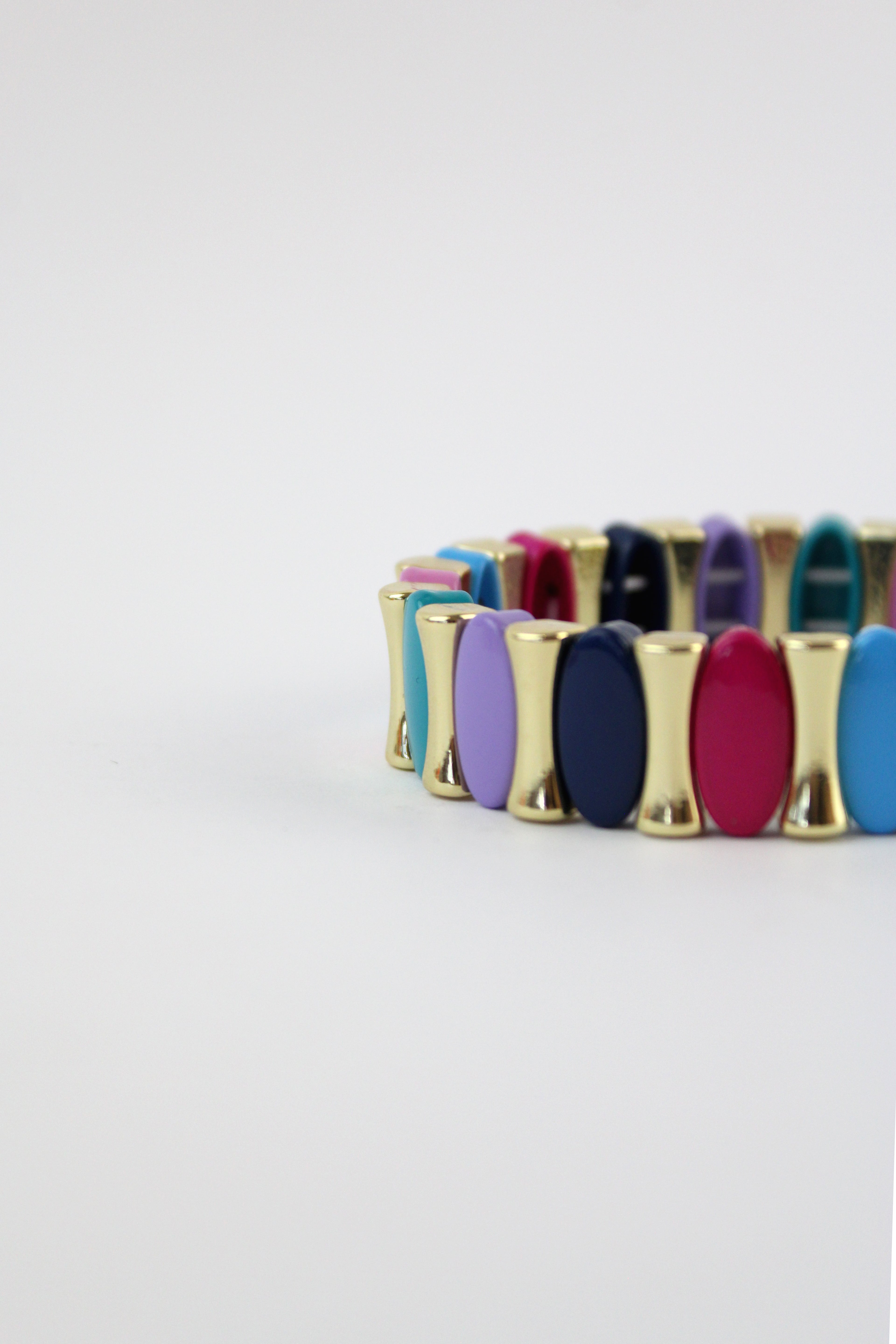 P274624 Pulsera Elastica Ovalos y Huesitos Colores