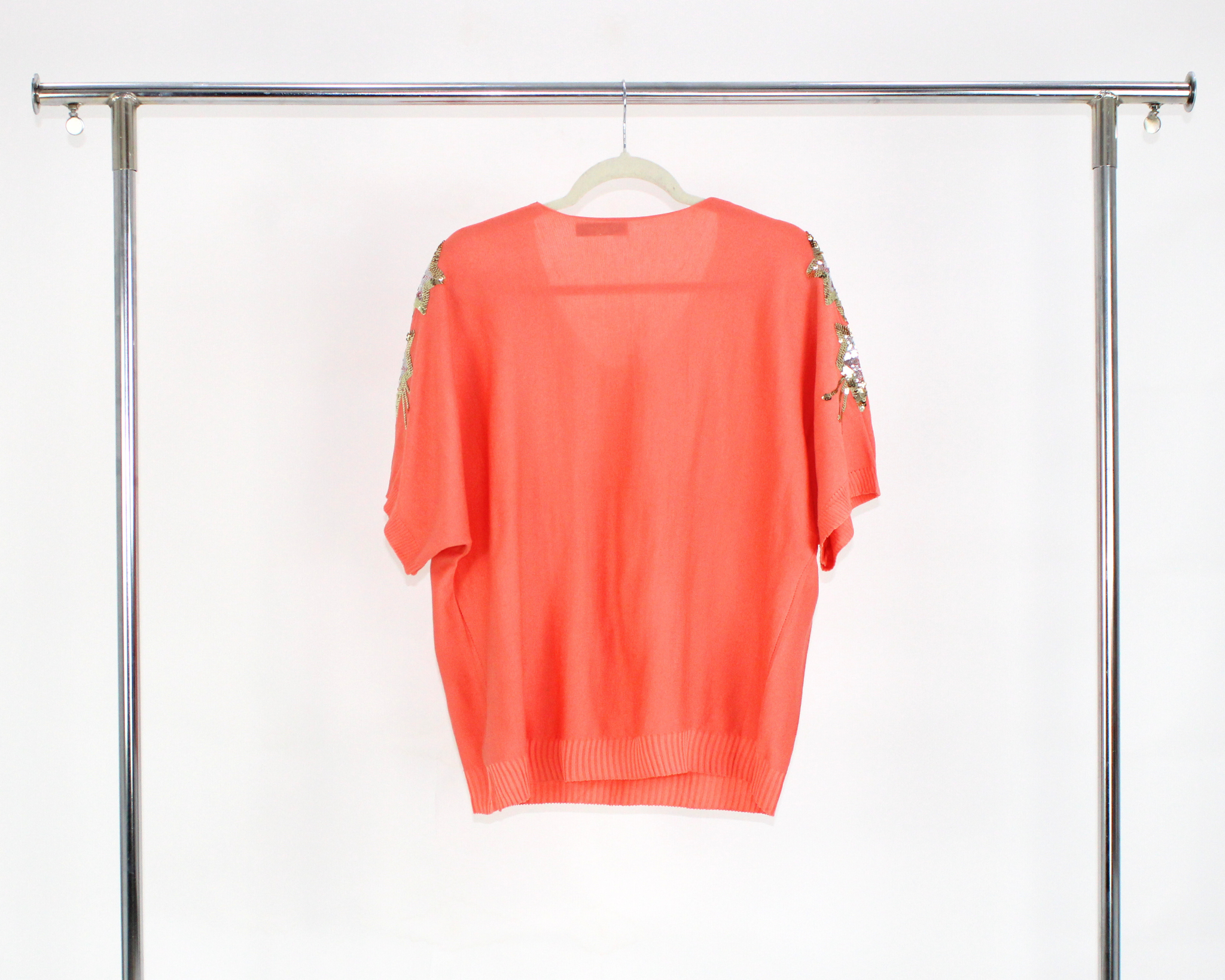 A040 Blusa Tejida Con Bolsas y Estrellas Brillosas en Hombros
